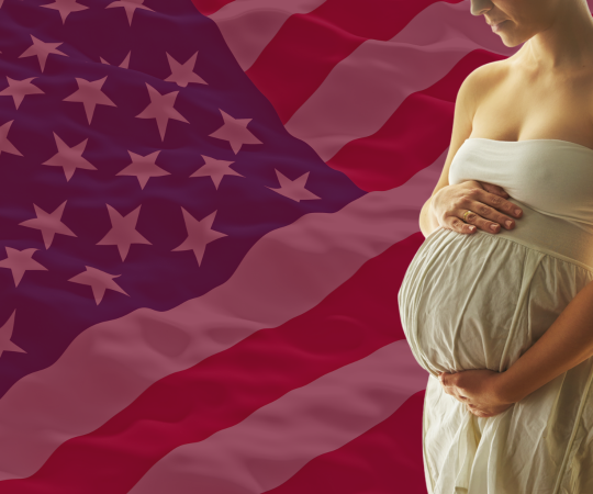 pregnant woman in front of US flag