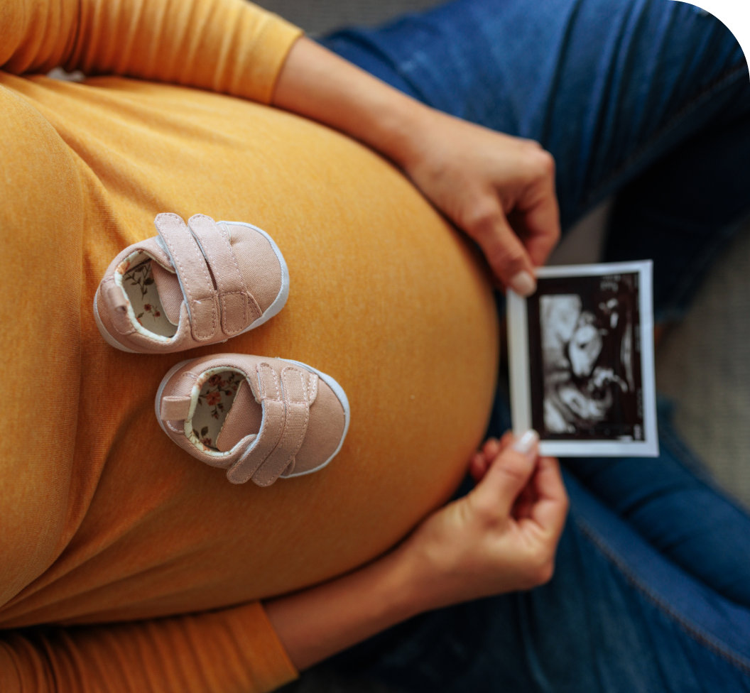 pregnant woman looking at a sonogram